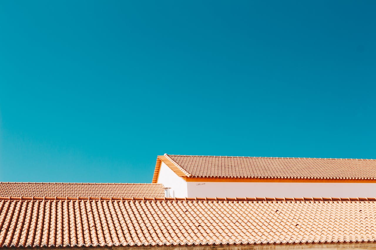 Crafting Captivating Headlines: Your awesome post title goes here A serene image of terracotta roofs contrasting with a vibrant blue sky, showcasing architectural simplicity.